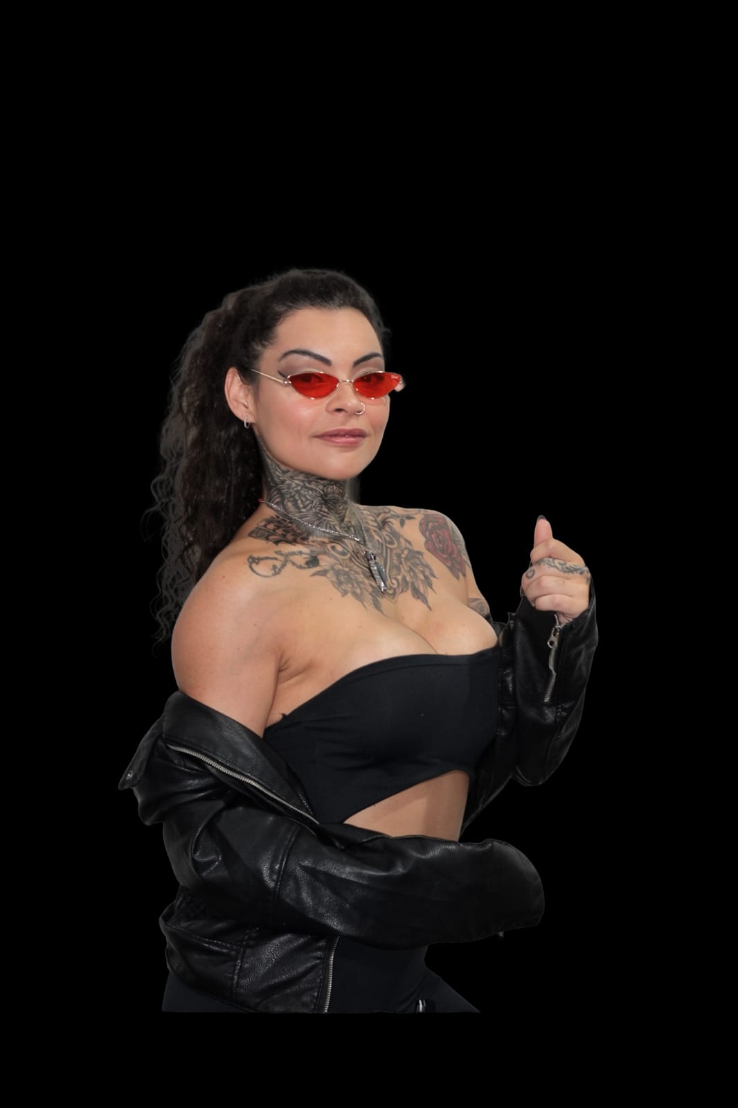 Portrait of ALVORÁ wearing a leather jacket and red-tinted sunglasses